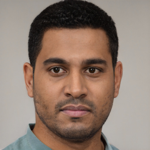 Neutral latino young-adult male with short  black hair and brown eyes