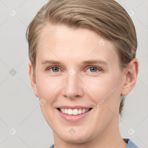 Joyful white young-adult female with short  brown hair and grey eyes