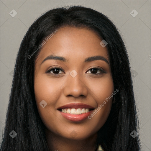 Joyful latino young-adult female with long  black hair and brown eyes