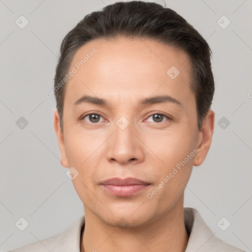 Joyful white adult male with short  black hair and brown eyes