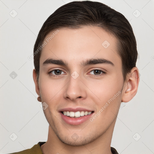 Joyful white young-adult male with short  brown hair and brown eyes