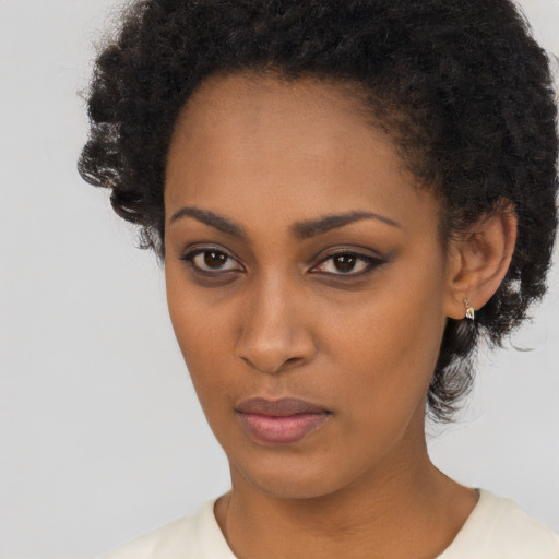 Neutral black young-adult female with short  black hair and brown eyes