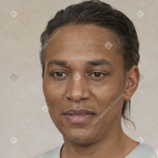 Joyful white adult male with short  black hair and brown eyes