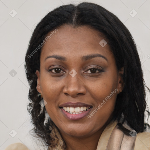 Joyful black adult female with medium  brown hair and brown eyes