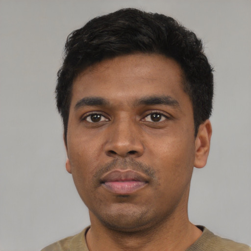 Neutral black young-adult male with short  black hair and brown eyes