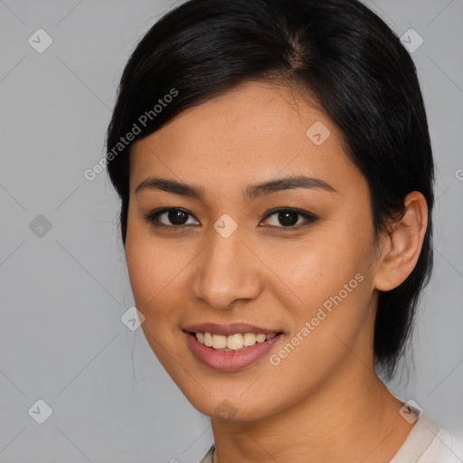 Joyful asian young-adult female with medium  black hair and brown eyes