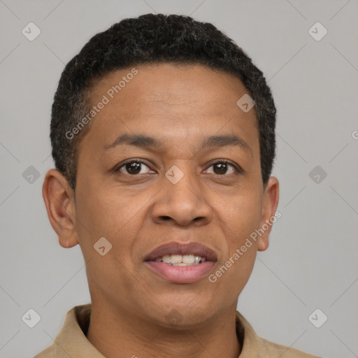 Joyful latino adult male with short  brown hair and brown eyes