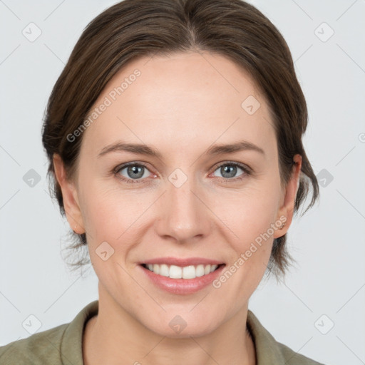 Joyful white young-adult female with medium  brown hair and grey eyes