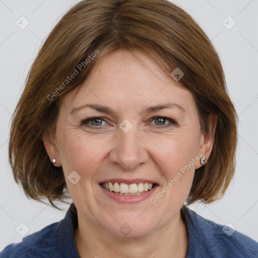 Joyful white adult female with medium  brown hair and grey eyes