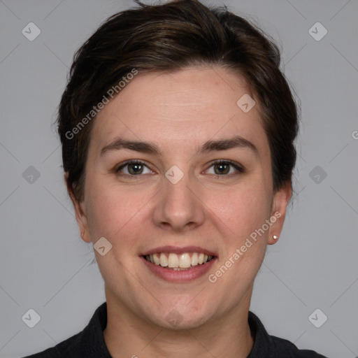 Joyful white young-adult female with short  brown hair and grey eyes