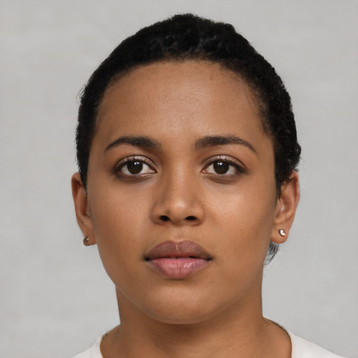 Neutral latino young-adult female with short  black hair and brown eyes