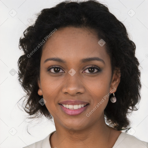 Joyful black young-adult female with long  black hair and brown eyes