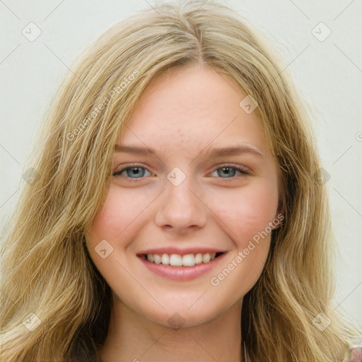 Joyful white young-adult female with long  brown hair and blue eyes