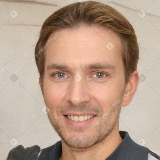 Joyful white adult male with short  brown hair and brown eyes