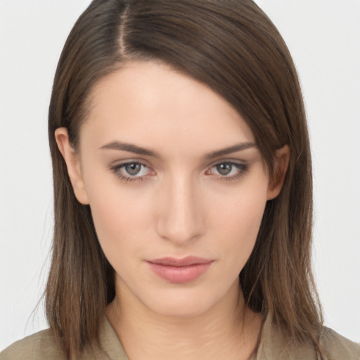 Neutral white young-adult female with long  brown hair and brown eyes