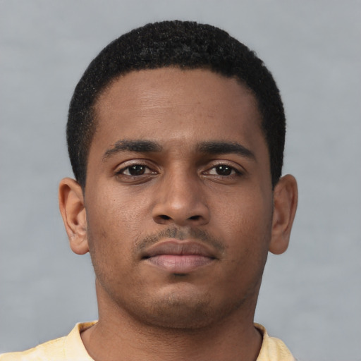Neutral latino young-adult male with short  brown hair and brown eyes