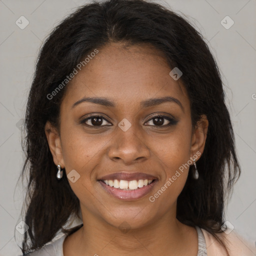 Joyful black young-adult female with medium  brown hair and brown eyes