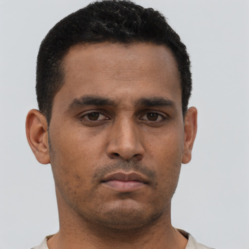 Neutral black young-adult male with short  brown hair and brown eyes