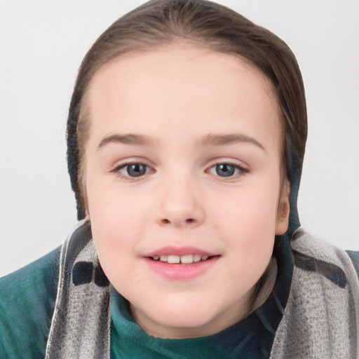 Joyful white child female with short  brown hair and grey eyes