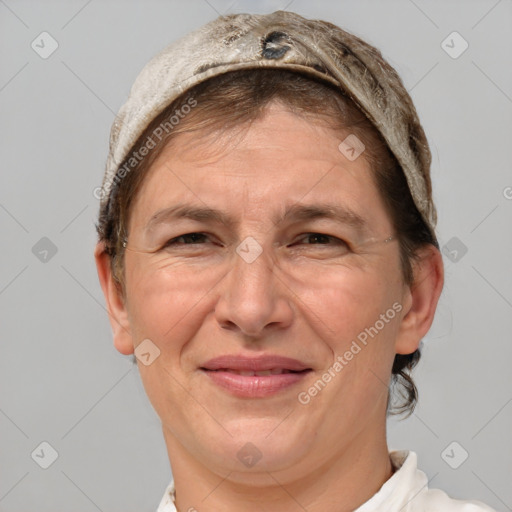 Joyful white adult female with short  brown hair and grey eyes