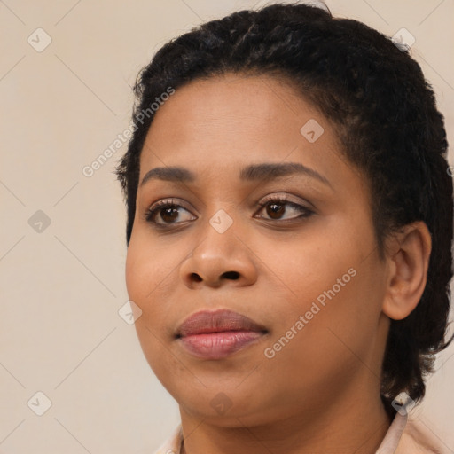 Joyful black young-adult female with medium  black hair and brown eyes