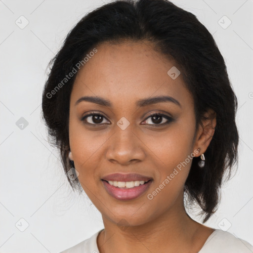 Joyful black young-adult female with medium  brown hair and brown eyes