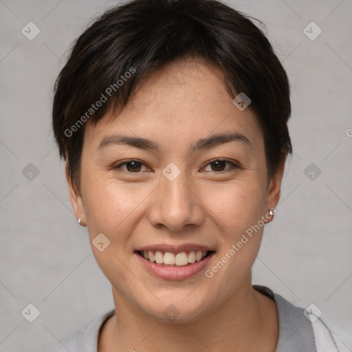 Joyful asian young-adult female with short  brown hair and brown eyes