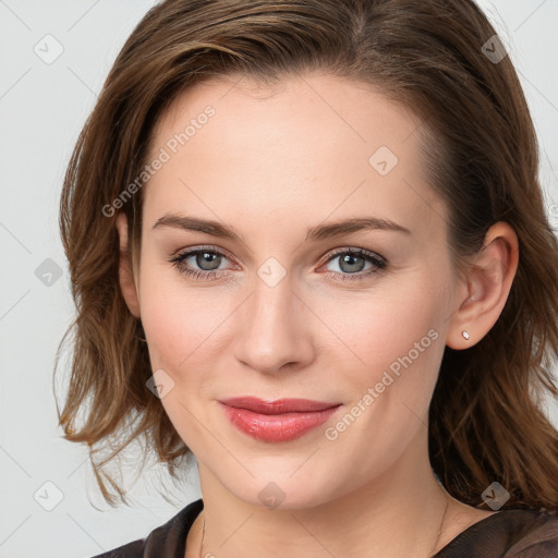 Joyful white young-adult female with medium  brown hair and blue eyes