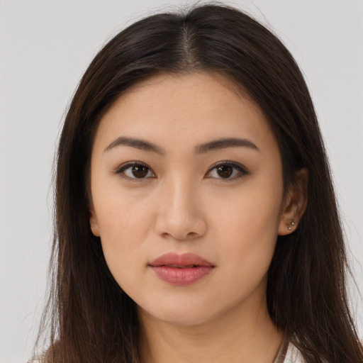Neutral latino young-adult female with long  brown hair and brown eyes