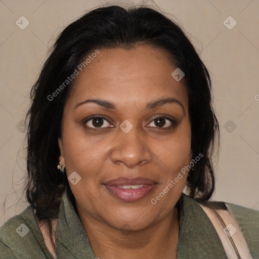Joyful black adult female with medium  brown hair and brown eyes