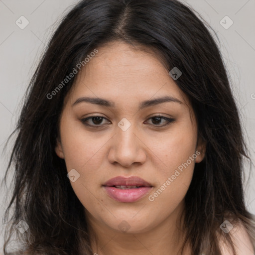 Joyful latino young-adult female with long  brown hair and brown eyes