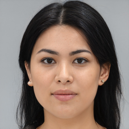 Joyful asian young-adult female with long  brown hair and brown eyes