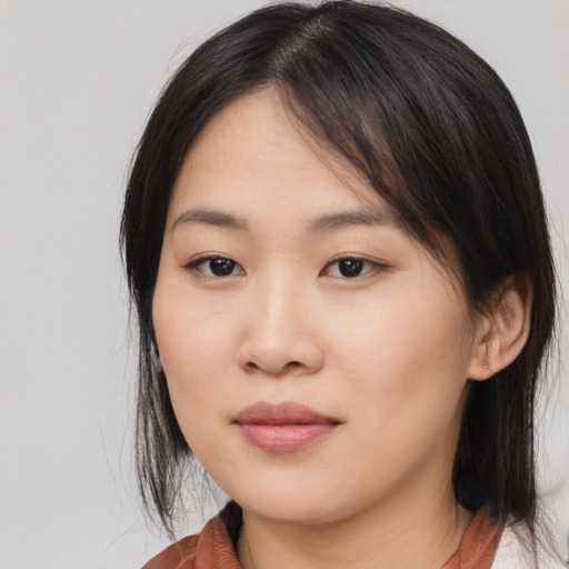 Neutral asian young-adult female with medium  brown hair and brown eyes