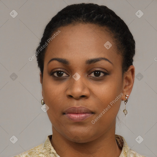 Joyful black young-adult female with short  black hair and brown eyes