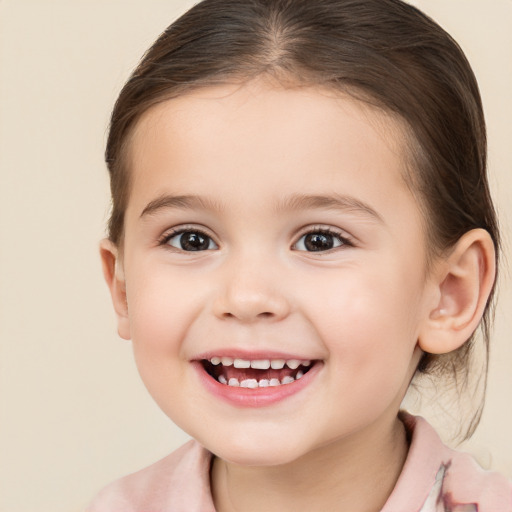 Joyful white child female with medium  brown hair and brown eyes