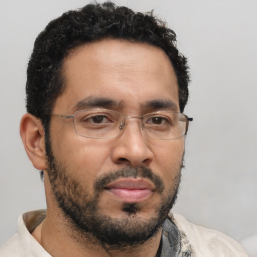 Neutral latino adult male with short  brown hair and brown eyes