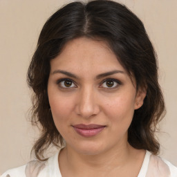 Joyful white young-adult female with medium  brown hair and brown eyes