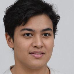 Joyful asian young-adult male with short  brown hair and brown eyes