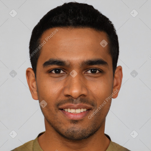 Joyful black young-adult male with short  black hair and brown eyes