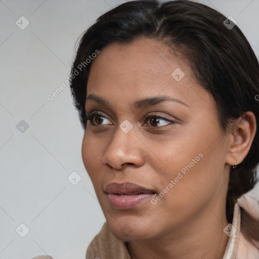 Joyful latino young-adult female with short  brown hair and brown eyes