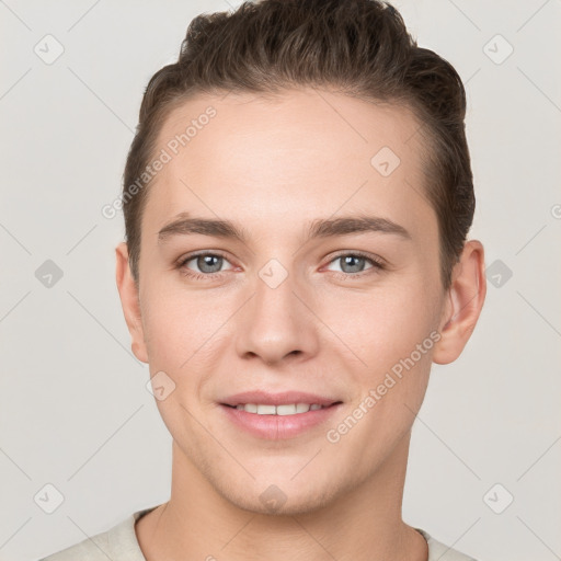 Joyful white young-adult female with short  brown hair and grey eyes