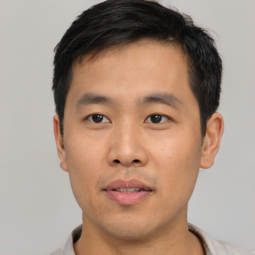 Neutral asian young-adult male with short  black hair and brown eyes