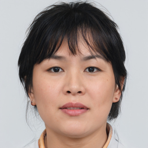 Neutral asian young-adult female with medium  brown hair and brown eyes