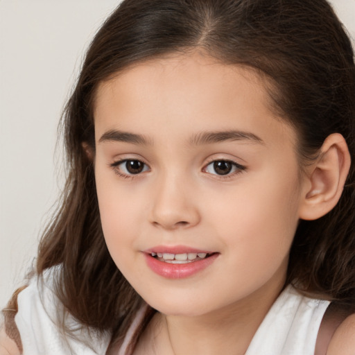 Joyful white child female with medium  brown hair and brown eyes