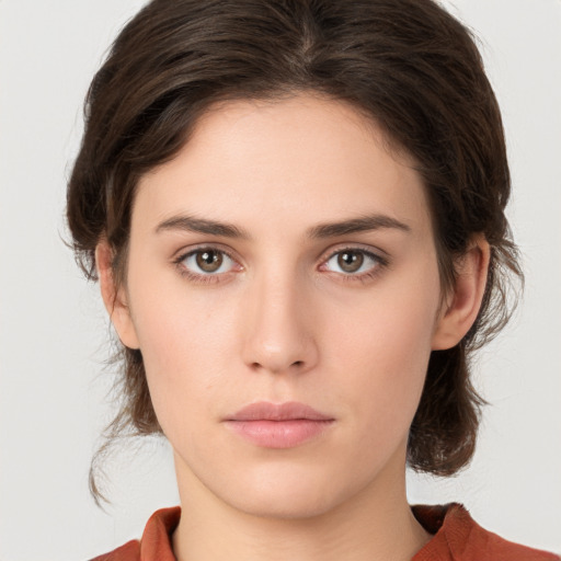 Neutral white young-adult female with medium  brown hair and green eyes