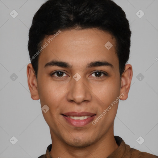 Joyful latino young-adult male with short  black hair and brown eyes