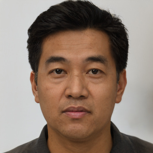 Neutral asian adult male with short  black hair and brown eyes