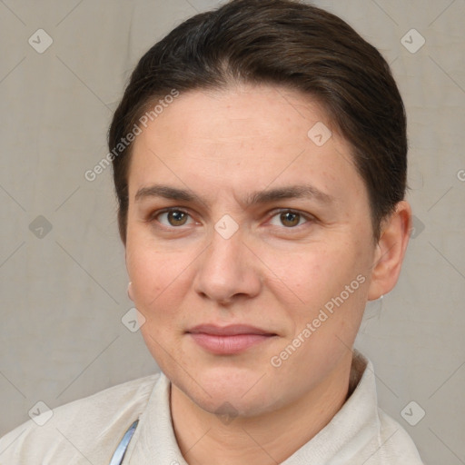 Joyful white adult female with short  brown hair and brown eyes