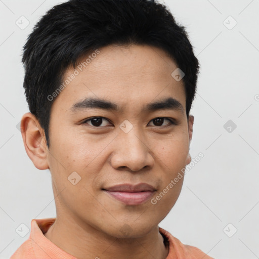 Joyful asian young-adult male with short  black hair and brown eyes