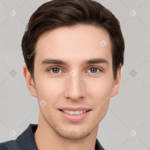 Joyful white young-adult male with short  brown hair and grey eyes